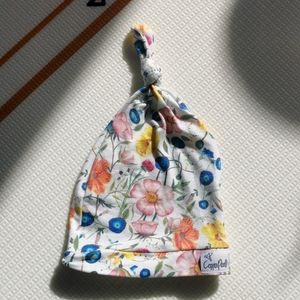 Copper pearl top knot baby hat